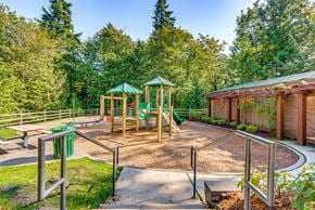 Issaquah apartment for rent - A playground with a green canopy and a slide.