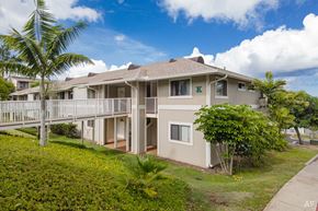 Kapolei apartment for rent - a house with a deck and a palm tree