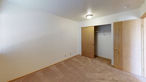 Ferndale apartment for rent - a bedroom with a closet and a door to a wardrobe