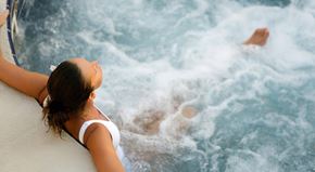 Bellingham apartment for rent - A woman in a white bikini is enjoying a wave pool.