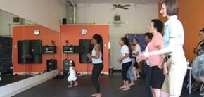 Seattle apartment for rent - A group of people are dancing in a studio.