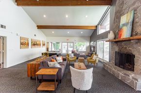 Bremerton apartment for rent - a living room with couches and chairs and a fireplace