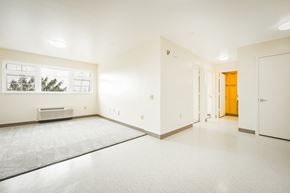 Kapolei apartment for rent - the living room and entrance of an empty house with white walls and flooring