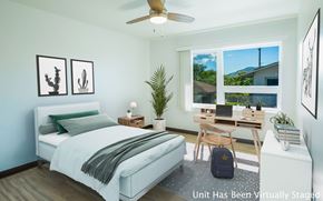 Walanae apartment for rent - A bedroom with a bed, desk, and chair.