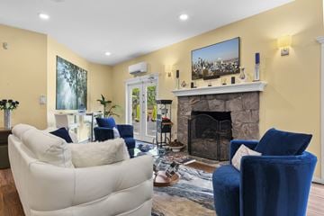 Bellevue apartment for rent - A living room with a fireplace and a painting on the wall.
