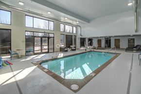 Auburn apartment for rent - a swimming pool in the center of a room with large windows
