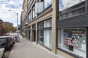 Seattle apartment for rent - A street view of a building with a window display that reads "Shift Creative Freedom".