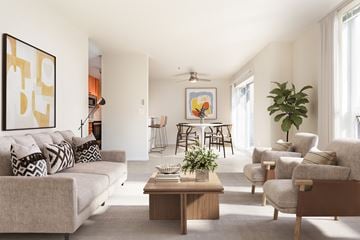 Seattle apartment for rent - A living room with a grey couch, a coffee table, and a painting on the wall.
