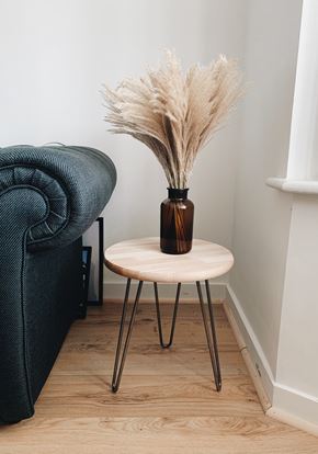 Bellingham apartment for rent - a small table with a vase on it next to a chair