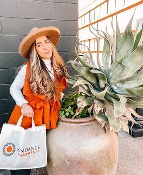 Davis apartment for rent - A Sundance team member holding a bag from the Sundance care program.