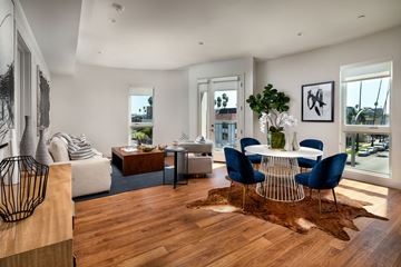 Los Angeles apartment for rent - a living room with a dining room table and a couch