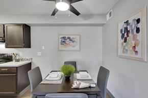 Denver apartment for rent - A dining room with a table set for two and a ceiling fan.