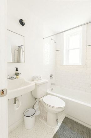 Detroit apartment for rent - a white bathroom with a toilet and a sink