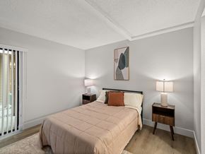 Madison Heights apartment for rent - A bedroom with a large bed and two lamps.