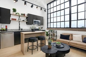 Detroit apartment for rent - a living area with a kitchen and a couch