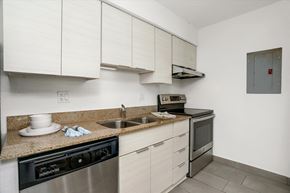 Detroit apartment for rent - a kitchen with stainless steel appliances and a granite counter top