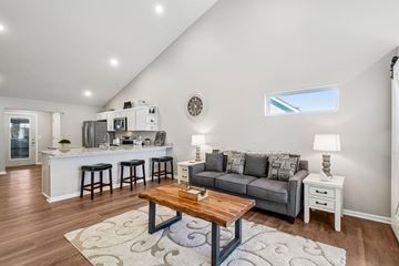 Howell apartment for rent - A living room with a grey couch and a wooden coffee table.