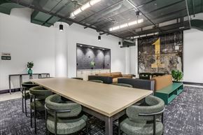 Detroit apartment for rent - A conference room with a long table and chairs.