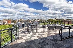 Washington apartment for rent - A rooftop patio with a black and white checkered floor.