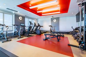 Washington apartment for rent - a fitness room with exercise bikes and weights