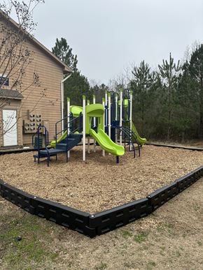 Gulfport apartment for rent - a playground with a set of slides and other playground equipment