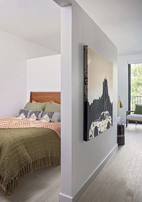 Detroit apartment for rent - a bedroom with a bed and a painting on the wall