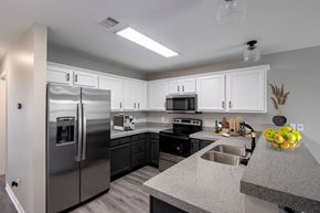 North Little Rock apartment for rent - a kitchen with stainless steel appliances and granite counter tops