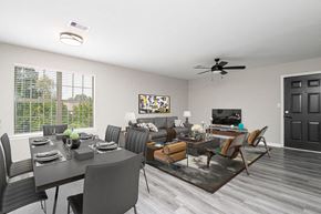 North Little Rock apartment for rent - a living room and dining room with a table and chairs