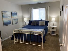 Indianapolis apartment for rent - a bedroom with a bed and a window