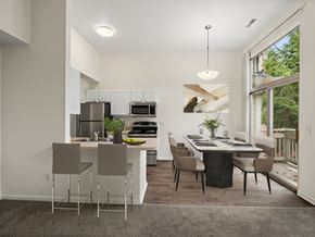 Novi apartment for rent - A modern kitchen with a dining table and chairs.