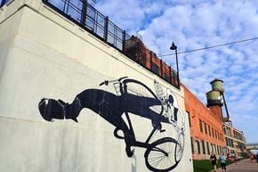 Detroit apartment for rent - a mural of a horse and carriage on the side of a building