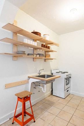 Detroit apartment for rent - a small kitchen with a sink and a stove
