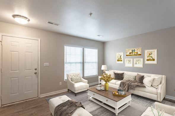 Gulfport apartment for rent - a living room with grey walls and white furniture
