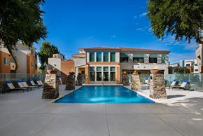 Phoenix apartment for rent - a swimming pool in front of a house with a pool