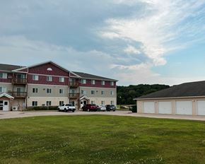 Jackson apartment for rent - an apartment building with a green lawn in front of it