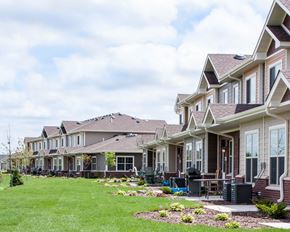 Northfield townhouse for rent - a row of houses on a grassy hill