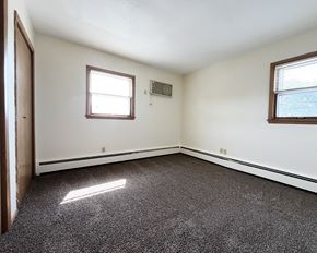 Mankato apartment for rent - an empty room with a door and two windows