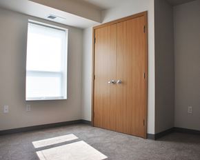 Elk River apartment for rent - an empty room with a door and a window