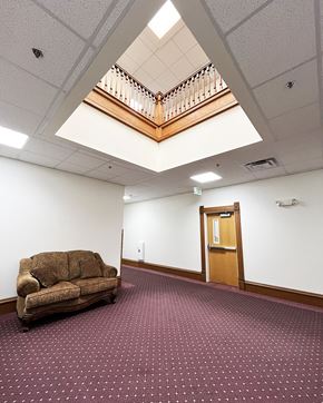 Olivia apartment for rent - a room with a couch and a staircase in the ceiling