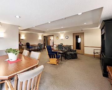 Northfield apartment for rent - A living room with a dining table and chairs.