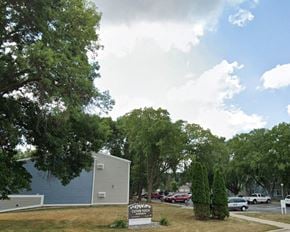 St. Charles apartment for rent - a parking lot with a sign in front of a building