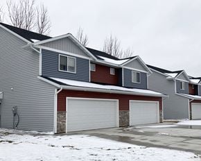 Mankato townhouse for rent - A row of houses with garages in front.