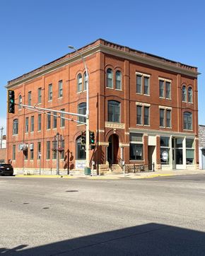 Olivia apartment for rent - a large brick building on the corner of a city street