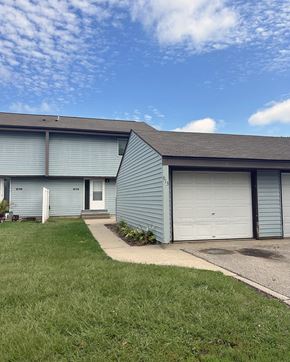 Litchfield townhouse for rent - A blue house with a white door and a garage door.