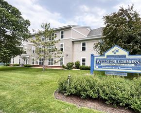 Northfield apartment for rent - A sign for Wellstone Commons is in front of a building.