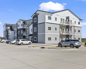 Luverne apartment for rent - an apartment building with cars parked in front of it