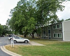 St. Charles apartment for rent - a row of cars parked in front of an apartment building