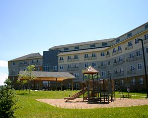Mankato apartment for rent - a playground in a park in front of an apartment building