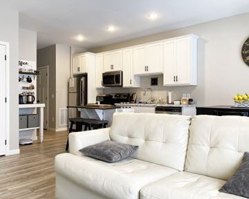 Mankato townhouse for rent - a white couch in a living room with a kitchen