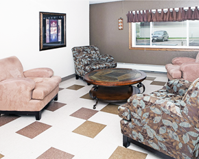 Northfield apartment for rent - A living room with a brown and white checkered floor.